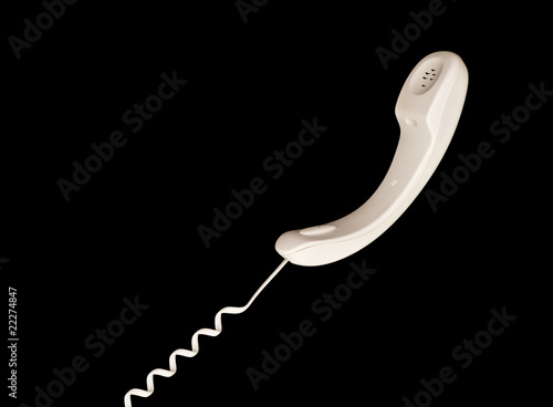Photo: White telephone receiver White telephone receiver