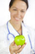 Photo: Female Doctor Holding Green Apple Female Doctor Holding Green Apple