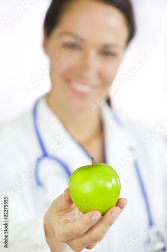 Photo: Female Doctor Holding Green Apple Female Doctor Holding Green Apple