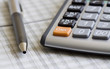 Balancing the Accounts. Calculator, pen