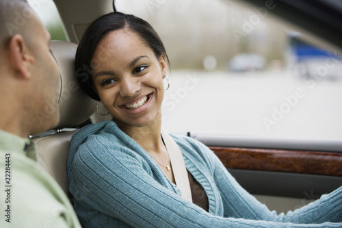 Photo: African teenager in car with father African teenager in car with father