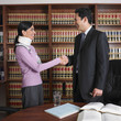 Male lawyer shaking hands with injured client