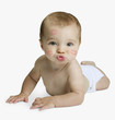 Studio shot of baby blowing kiss