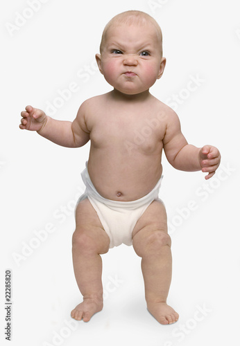 Photo: Studio shot of baby looking angry Studio shot of baby looking angry