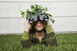 Mixed Race boy looking through binoculars