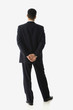Hispanic businessman with hands behind back