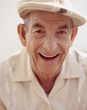 Senior Hispanic man wearing hat