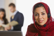 Middle Eastern businesswoman wearing headset