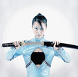 Asian woman holding samurai sword