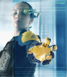 Digital composite of woman using futuristic touch screen
