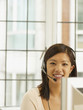 Asian businesswoman wearing headset