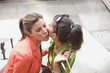 Middle Eastern women greeting each other with kiss