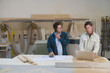 Multi-ethnic men working in wood shop