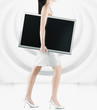 Pacific Islander woman carrying lcd screen