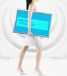 Pacific Islander woman carrying lcd screen