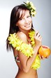 Beautiful exotic girl  drinking grapefruit juice