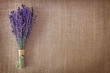 Bunch of dried lavender flowers on brown background