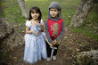 Hispanic siblings wearing Halloween costume