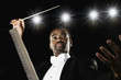 African male conductor holding baton