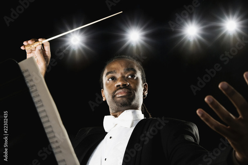 Photo: African male conductor holding baton African male conductor holding baton