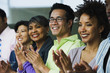 Multi-ethnic business people clapping