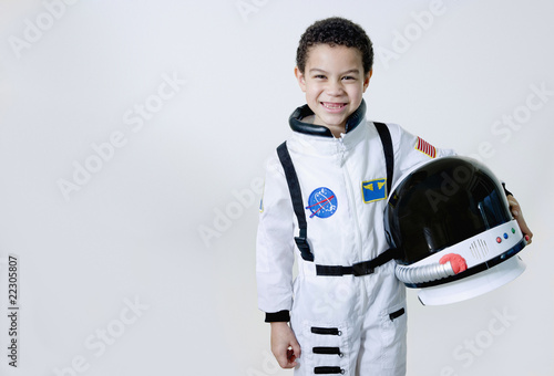 Photo: Mixed race boy in astronaut costume Mixed race boy in astronaut costume