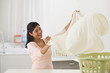 Indian woman folding laundry