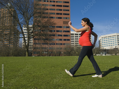 Photo: Pregnant Middle Eastern woman walking for exercise Pregnant Middle Eastern woman walking for exercise
