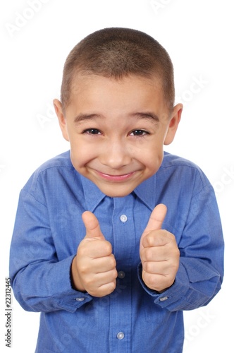 Foto: Smiling boy giving thumbs up sign, isolated on white Smiling boy giving thumbs up sign, isolated on white