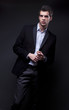 Photo: fashion shot of an elegant young man wearing suit fashion shot of an elegant young man wearing suit