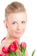 Young woman with bunch of tulips