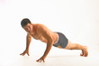 white male athlete performs finger pushups