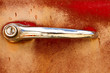 Photo: Grungy classic car door handle Grungy classic car door handle