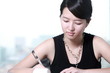 Photo: young asian business woman writing something young asian business woman writing something