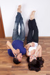 Young couple at home speaking at phones