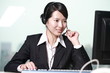 Photo: business woman working with headphone business woman working with headphone
