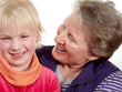 Foto: Granddaughter and grandmother smiling, having fun and hugging Granddaughter and grandmother smiling, having fun and hugging