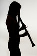 shadow of a woman clarinet player