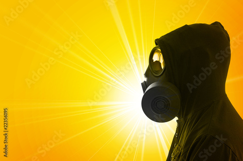 Photo: Man in hoody with gas mask Man in hoody with gas mask