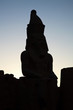 Statue At Karnak Silhouetted Like A Chess Piece At Sunset