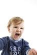 Portrait of angry baby boy closeup