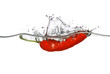 red pepper dropped into water with splash isolated on white