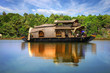 Houseboat in backwaters in India Houseboat in backwaters in India