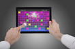 male hand holding a touchpad pc and playing a retro arcade game