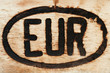 European sign engraved on a piece of wood