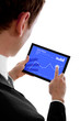 Businessman holding a touchpad pc, checking the stock market