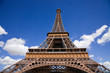 Wide angle of the Eiffel Tower against a deep blue sky