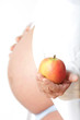 Foto: Schwangere mit Apfel Schwangere mit Apfel