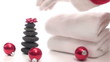 Santa places bow on Spa massage stones - HD
