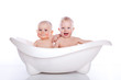 children in white bath tub on white background